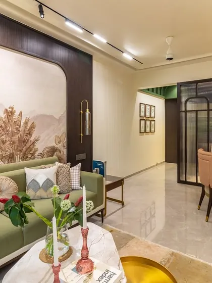 A living room where elegance meets earthy charm. I used a sage green sofa as the anchor, complemented by a botanical wallpaper and layered textiles to create a space that feels both exquisite and serene.