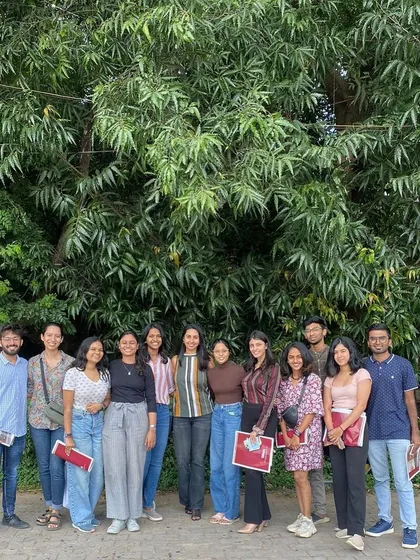 Glimpses of our team at the studio. We foster a collaborative and fun environment where ideas are shared openly, often with our furry studio manager keeping a watchful eye.