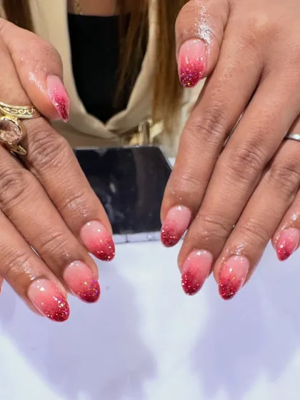 A fiery and glamorous look, these almond nails feature a nude-to-red ombré effect, with the red tips packed with sparkling glitter.
