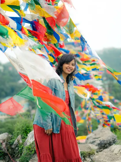 A happy moment in Mussoorie, with colorful Tibetan prayer flags fluttering in the wind. Being in the mountains, camera in hand, is my happy place.