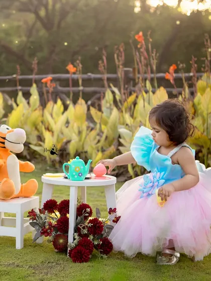 Hrutvi enjoying her first birthday tea party with her friend, Tigger. I love incorporating your child's favorite toys to make the session more personal.