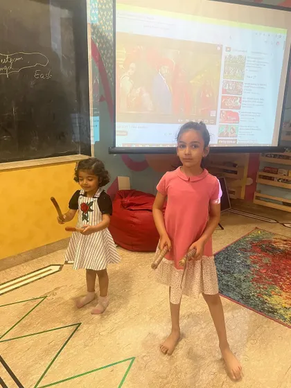 During our spring camp, we learned about different cultural dances. Here, the children are trying out some moves themselves.