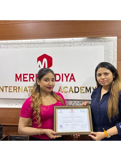 Celebrating another student's success. Her dedication has paid off, and she is now a certified professional ready for the industry.