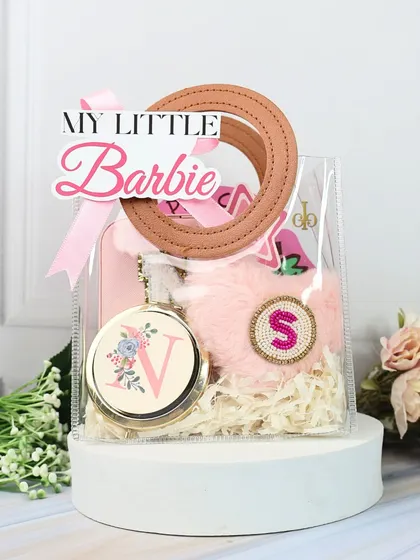 The "My Little Barbie" hamper, all packed up in a clear bag with a cute tag. It's a magical and glamorous gift for any sister on Raksha Bandhan.