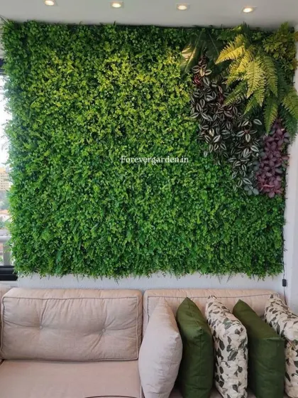 A living room feature wall made of artificial greenery, creating a stunning and relaxing backdrop for the sofa.