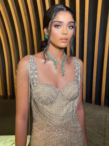 A close-up of the glamorous reception look. Learn how to create flawless skin and a captivating eye look for evening events.