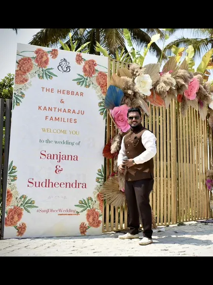 Ready to kick off the Haldi and Mehendi events, standing by the couple's beautiful welcome sign.