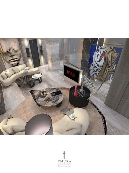 An unconventional layout for a penthouse lounge, using curved sofas to create a circular flow around multiple coffee tables. Wall art and sculptures are placed to be discovered as one moves through the space.