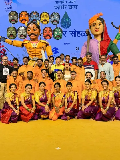 The entire team of dancers and performers with the giant puppets for the Paani Foundation's Farmer Cup. A truly epic production.