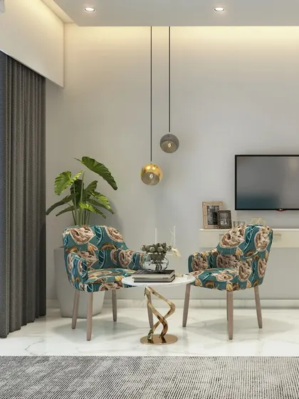 A bright and airy living space featuring patterned accent chairs that add a pop of personality. The minimalist TV console and pendant lights keep the look clean and modern.