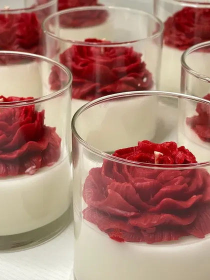 My Peony jar candles look like a dream. The vibrant red wax peony, set against the white wax in a clear glass jar, is a truly striking design.