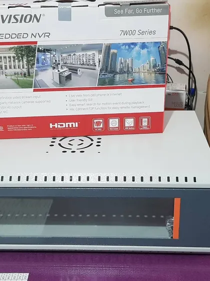 A Hikvision NVR box placed on top of a server rack, which I use to house recording equipment for a clean and organized installation.