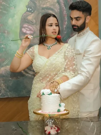 A romantic moment during an engagement shoot, with the groom helping the bride cut the cake. I focus on capturing gestures of love and partnership.