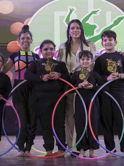 Our talented Hula Hoop students with their instructor at the 'Magnifique' showcase. We are proud to offer unique skills and see our students master them.