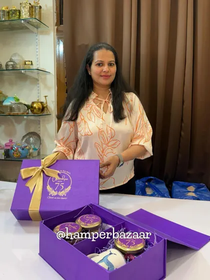 Posing proudly with the 75th birthday hamper we created! We love bringing your vision to life and creating gifts that celebrate life's biggest milestones.