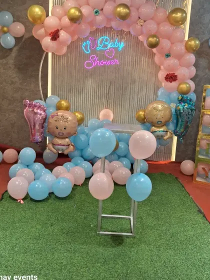 Another angle of the baby shower setup, showing the cake table stand and 'BABY' blocks. I can provide different props based on what you need for your event.