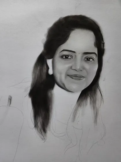 A progress shot showing the hair partially completed.