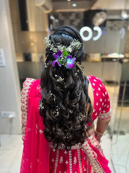 Another view of the floral curly hairstyle, perfect for a mehendi or sangeet.
