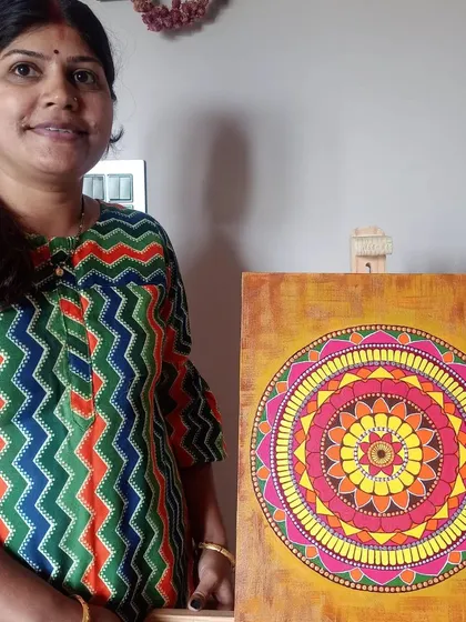Another shot of Bhavana and her beautiful mandala. Creating art is a journey, and I am here to guide you every step of the way.
