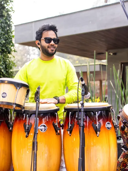 A sundowner gig with Farhan Akhtar and the band. I'm on the congas here, providing a smooth, groovy rhythm that's perfect for an evening concert setting.