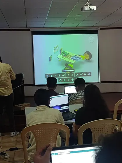 Here we are wrapping up a 'Robotics 101' workshop for college students. We teach 3D design using software like Fusion 360, bridging the gap between virtual design and physical creation.