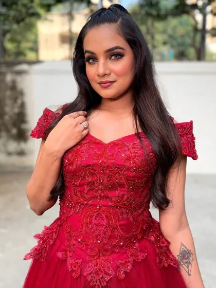 A confident pose from the client. The makeup, hair, and outfit all come together to create a powerful and beautiful image.