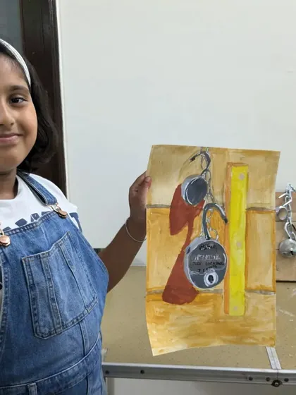 A student from our junior batch with her painting of locks. This still life setup helps teach how to draw and paint metallic textures and complex, interlocking shapes.