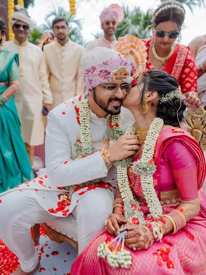 A vibrant varmaala ceremony with colorful smoke, creating a truly spectacular and modern moment. We love capturing both the tradition and the unique personality of your wedding.