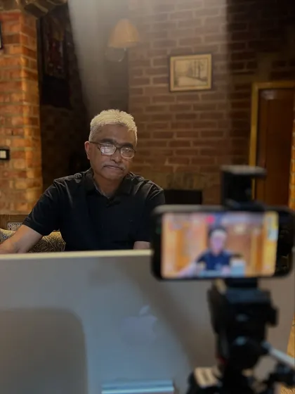 Preparing for an online discourse from my home studio. The setting is designed to be calm and inviting, reflecting the nature of the conversations we have.