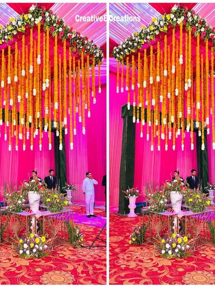 A stunning mandap with a ceiling of hanging marigold strings. This traditional design element creates a beautiful and sacred space for the wedding rituals.