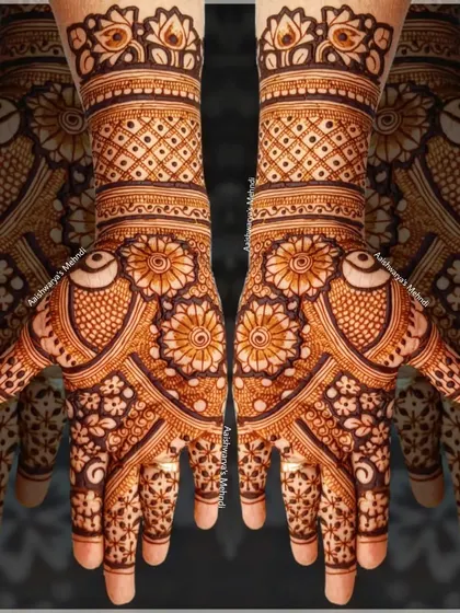A stunning design with bird motifs on the palms, surrounded by intricate floral and geometric patterns.
