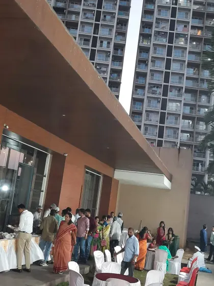 Guests enjoying the outdoor buffet at the Green World venue. I work with caterers to ensure their setup is also well-integrated.
