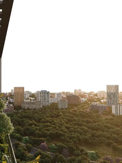 A detail from the Narmada project, showing the view from one of the personal landscape terraces. These green spaces are integral to the design, offering a connection to nature within a high-rise commercial environment.
