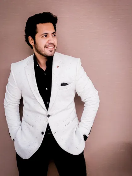 A different pose in the white blazer, looking away with a smile. This adds a touch of candid sophistication to my portfolio.