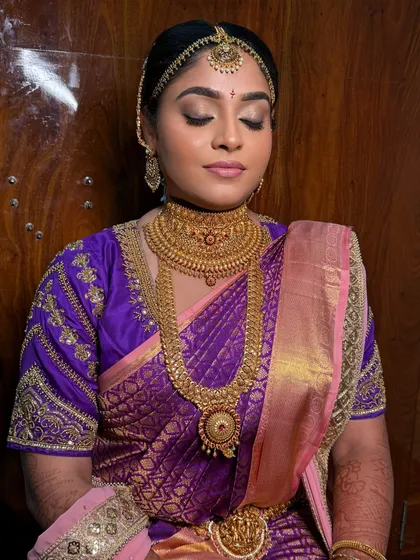 A close-up of Hima's makeup. The soft, glowing base and the beautifully defined eyes are perfect for her muhurtham look.