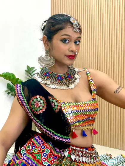 Here's how one of my mirror-work blouses looks when worn. This close-up shows the colorful embroidery and the flattering fit, paired with a statement oxidized necklace.