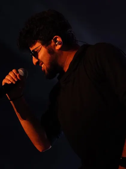 A close-up of a talented vocalist performing alongside Shreya Ghoshal, demonstrating the quality of the entire musical ensemble we bring to each show.