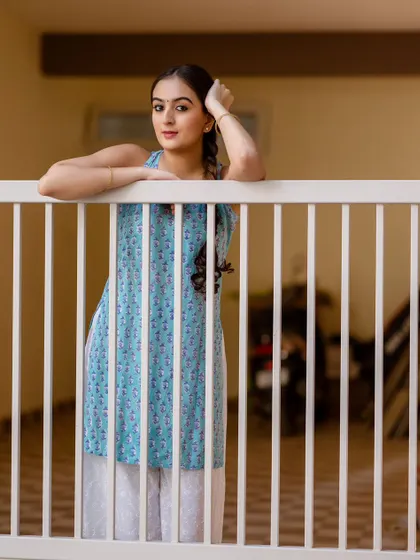 A different perspective from the same location, using the bars of the railing to frame the shot. It adds a layer of storytelling to the portrait.
