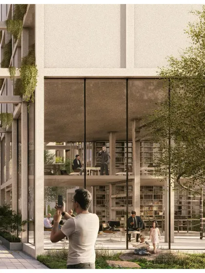 A resident captures a moment in the beautifully landscaped grounds of Pixel Housing, a project designed to be both photogenic and livable.