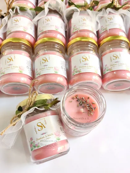 The final packaged wedding favors, showing the personalized jar, net wrapping, and custom thank you card.