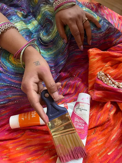 The magic is in the details. This is a close-up of the hand-painted fabric of my lehenga, showing the layers of acrylic color and the texture that makes each piece a true one-of-a-kind artwork.