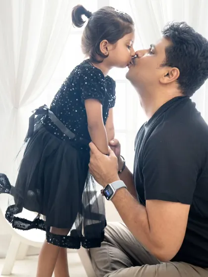 An adorable moment as a daughter gives her dad a kiss on the nose. These are the precious, unscripted moments that I love to capture.