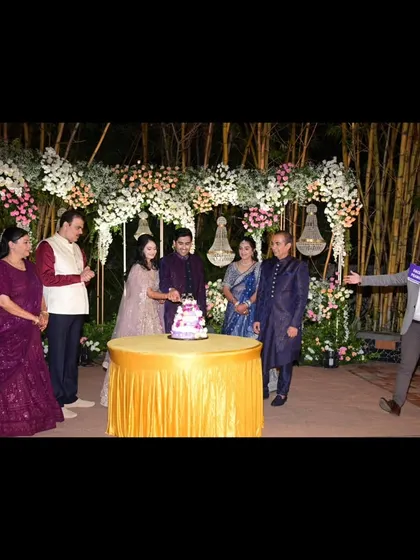 Guiding the cake-cutting ceremony with the couple and their families. I ensure these key moments are well-organized and heartfelt.