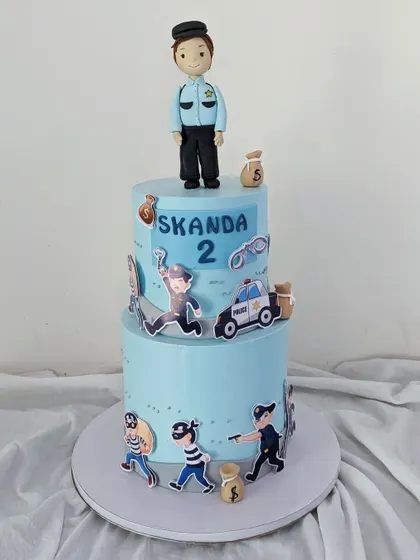 The full two-tiered police cake, ready for the party.