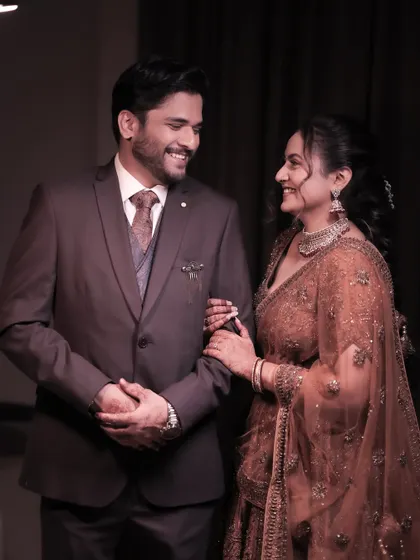 A happy couple shares a smile during their engagement party. We ensure our decor and event flow create a comfortable and joyous atmosphere where clients can relax and enjoy their special moments.
