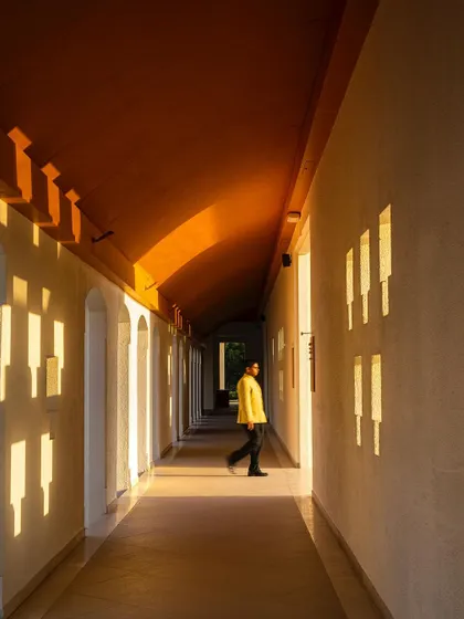 A corridor in the Bodhgaya hotel, where the architecture plays with light and shadow. The carefully placed openings create a rhythmic pattern, turning a simple passage into a meditative journey.