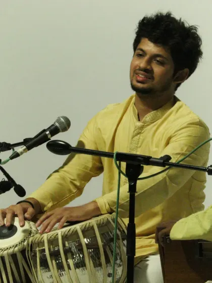 A moment of connection with the audience during a solo piece. The energy exchanged during a live concert is a vital part of the performance.