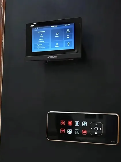 The indoor security station, featuring a video monitor and a smart control panel. This setup provides a centralized point for managing both security and home automation.