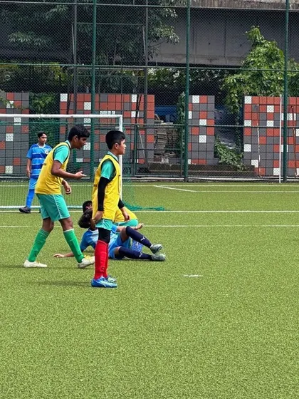 Players in blue and yellow bibs during a training game. Using bibs helps organize teams and makes our practice sessions more effective.