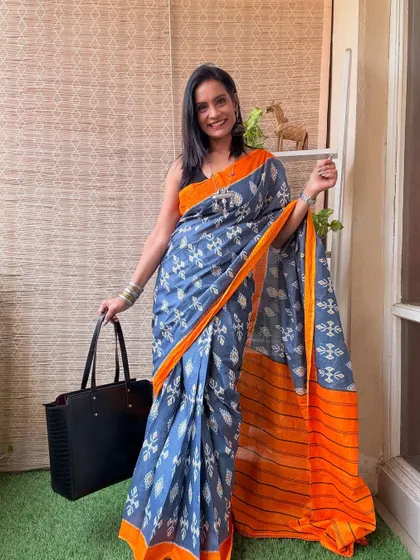 A beautiful grey and orange printed one-minute saree. The colors are sophisticated, and the print is elegant, making it a great workwear option.